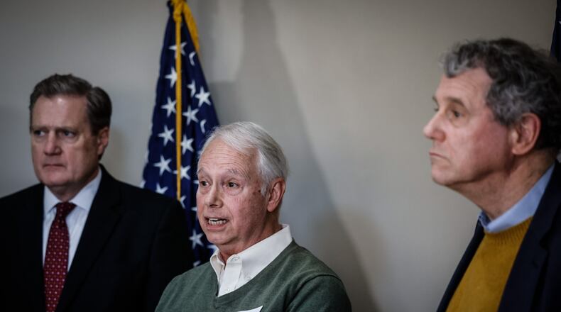 Chairman of the Delphi Salaried Retirees Association, Bruce Gump, center, talks about the struggles the retirees are living through without their pensions. JIM NOELKER/STAFF