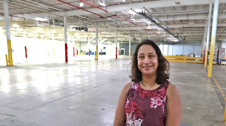 Shalini Sheth, director of operations for Surati, in the empty plant her company will move into soon on Upper Valley Pike. BILL LACKEY/STAFF