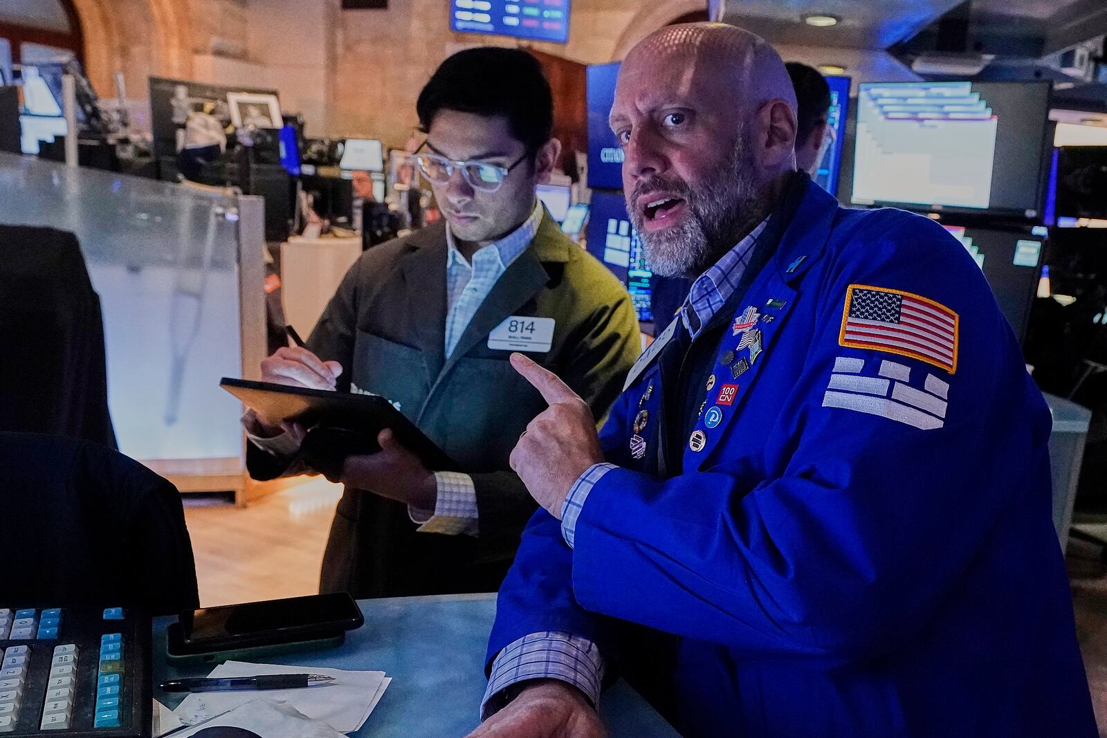 Trader Niall Pawa, left, and specialist Meric Greenberg work on the floor of the New York Stock Exchange, Monday, May 12, 2025. (AP Photo/Richard Drew)