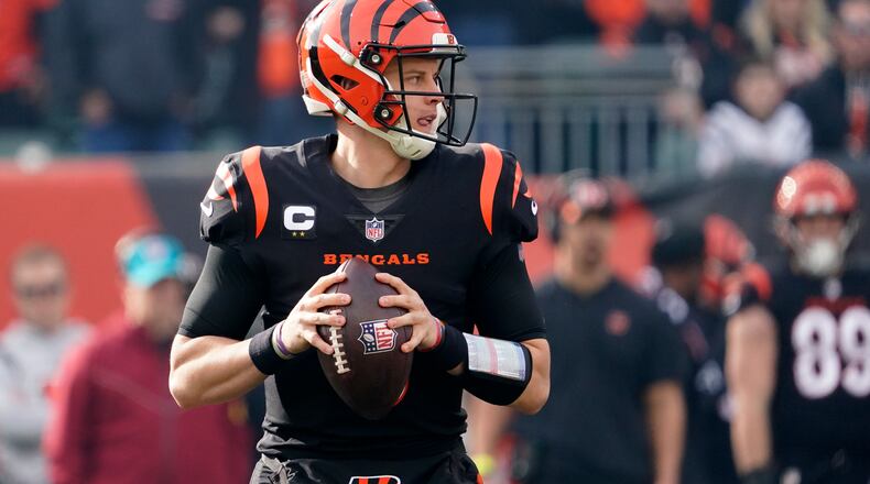 Cincinnati Bengals quarterback Joe Burrow (9) looks to throw during the fist half of an NFL football game against the Baltimore Ravens, Sunday, Dec. 26, 2021, in Cincinnati. (AP Photo/Jeff Dean)