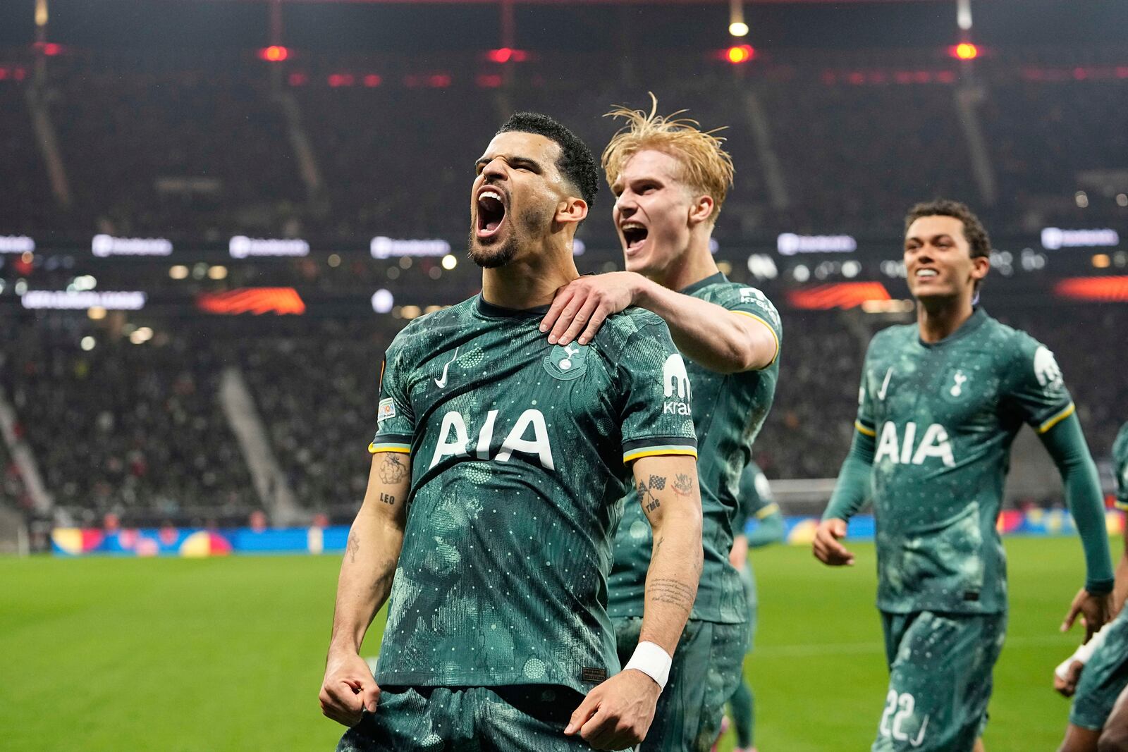 Tottenham's Dominic Solanke celebrates after scoring his side's opening goal during the Europa League quarterfinal second leg soccer match between Eintracht Frankfurt and Tottenham Hotspur, in Frankfurt, Germany, Thursday, April 17, 2025. (AP Photo/Martin Meissner)