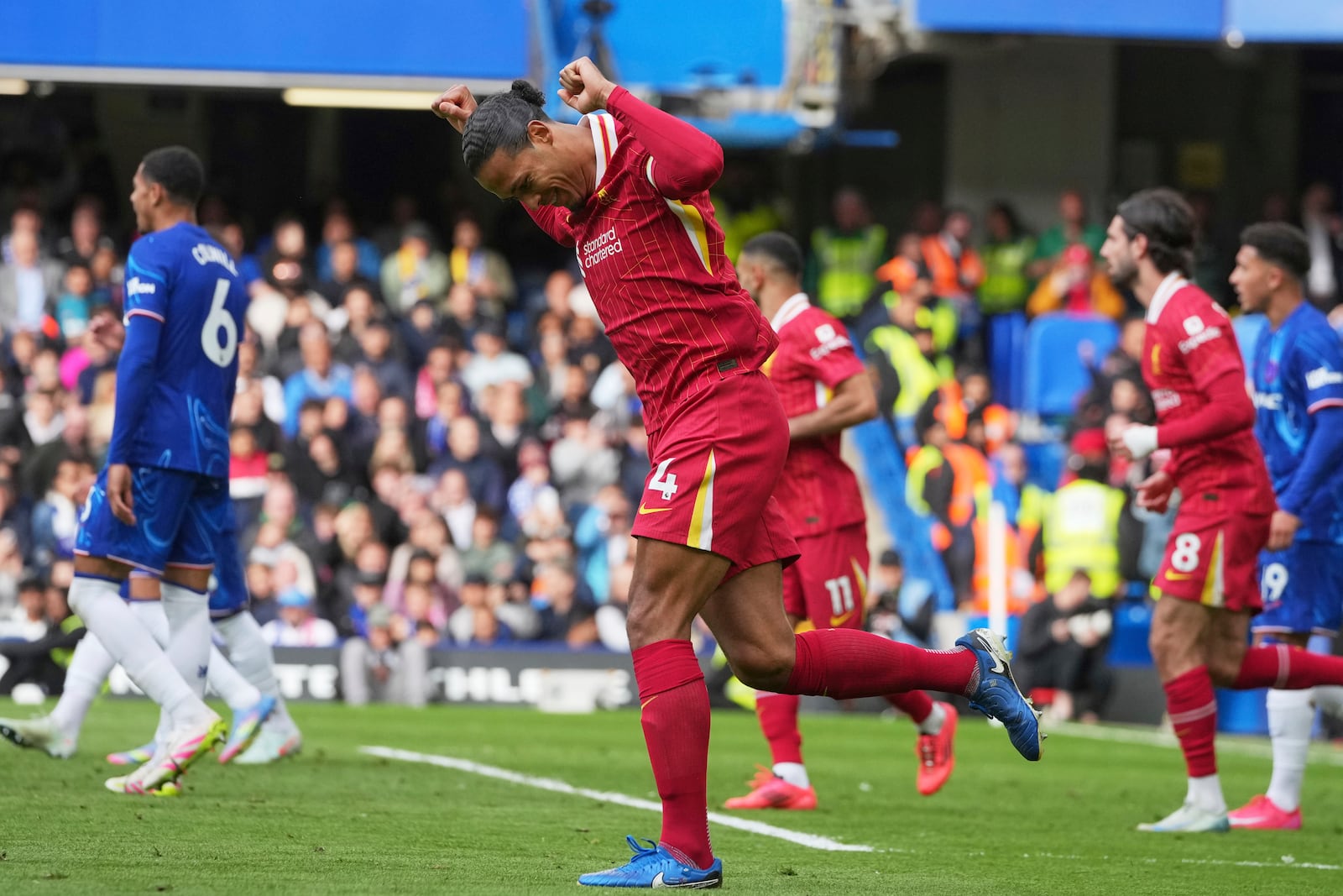 Liverpool's Virgil van Dijk celebrates scoring his side's first goal during the English Premier League soccer match between Chelsea and Liverpool at Stamford Bridge stadium in London, Sunday, May 4, 2025. (AP Photo/Kin Cheung)