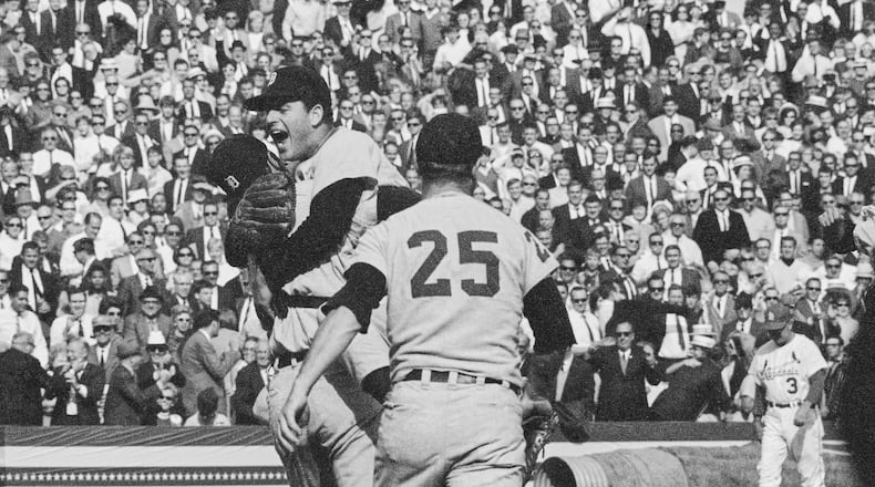 Detroit Tigers catcher Bill Freehan and pitcher Mickey Lolich off his feet as he screams with joy, after defeating the St. Louis Cardinals 4-1 in the final game of the World Series on Wednesday, Oct. 10, 1968 at Busch Stadium in St. Louis. Joining the celebration is Norm Cash (25). Lolich became the twelfth pitcher to win three games in the World Series. (AP Photo)