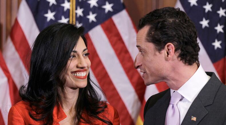 In this photo taken Jan. 5, 2011, then-New York Rep. Anthony Weiner and his wife, Huma Abedin, an aide to then-Secretary of State Hillary Clinton, are pictured after a ceremonial swearing in of the 112th Congress on Capitol Hill in Washington. Democratic presidential candidate Hillary Clinton aide Huma Abedin says she is separating from husband Anthony Weiner after another sexting revelation involving the former congressman from New York. (AP Photo/Charles Dharapak)