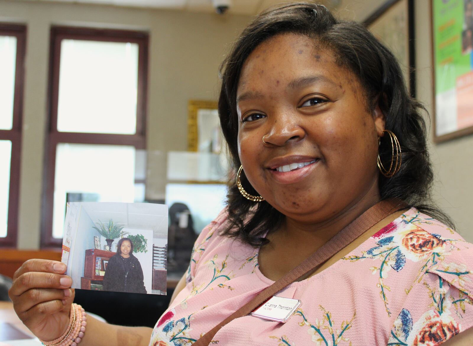 Cyanna Thornton holds a picture of herself taken while she was a student at the Dayton Job Corps Center on Gettysburg Avenue.