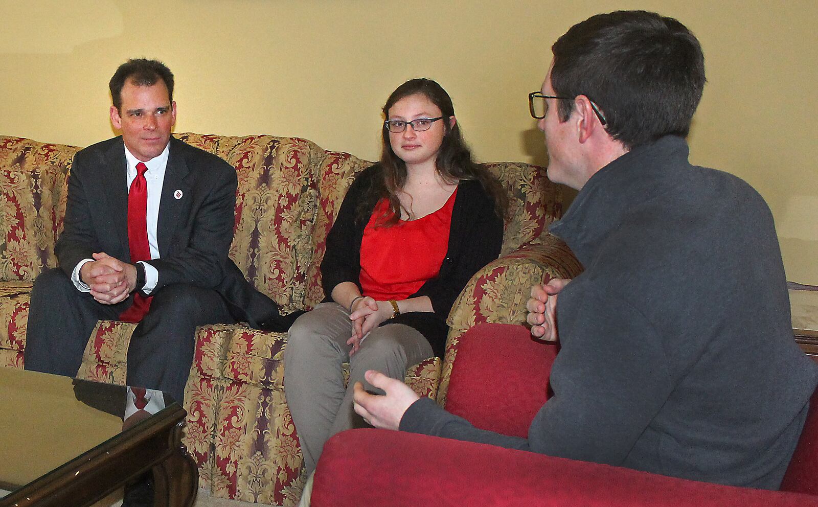 Michael Frandsen (left) meets with Wittenberg students Meghan Roderick and Casey Luther at the university president’s home on campus shortly after taking the role. JEFF GUERINI/STAFF