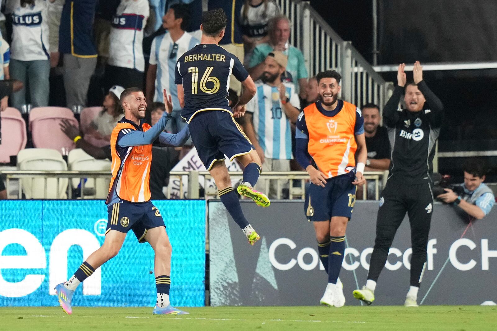 Vancouver Whitecaps midfielder Sebastian Berhalter (16) celebrates after scoring a goal during the second half of a CONCACAF Champions Cup second-leg semifinal soccer match against Inter Miami, Wednesday, April 30, 2025, in Fort Lauderdale, Fla. (AP Photo/Lynne Sladky)