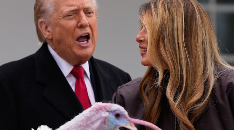 President Donald Trump and first lady Melania Trump, stand next to national Thanksgiving turkey Gobble during a pardoning ceremony in the Rose Garden of the White House, Tuesday, Nov. 25, 2025, in Washington. (AP Photo/Julia Demaree Nikhinson)