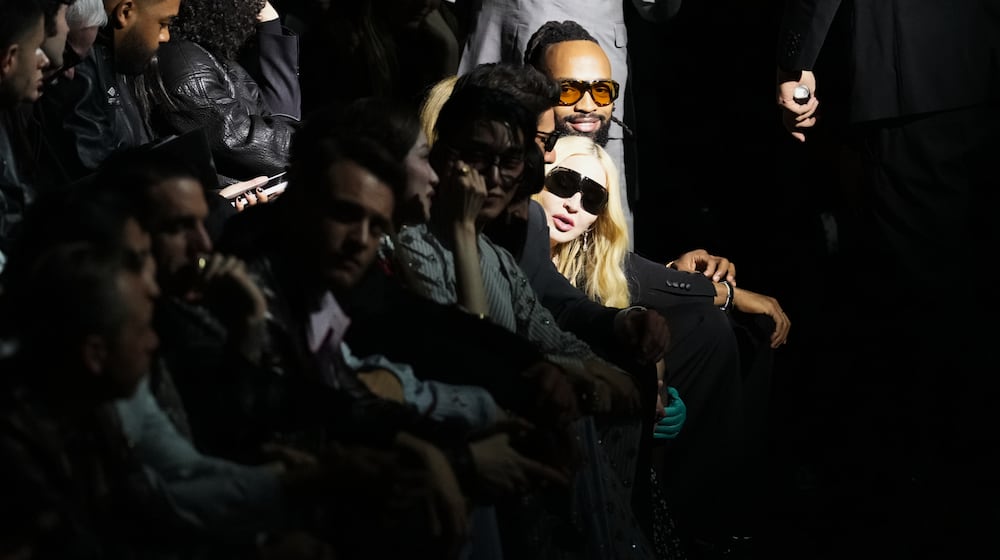 Madonna attends the Dolce & Gabbana Fall/Winter 2026-2027 Women's collection, presented in Milan, Italy, Saturday, Feb. 28, 2026. (AP Photo/Antonio Calanni)