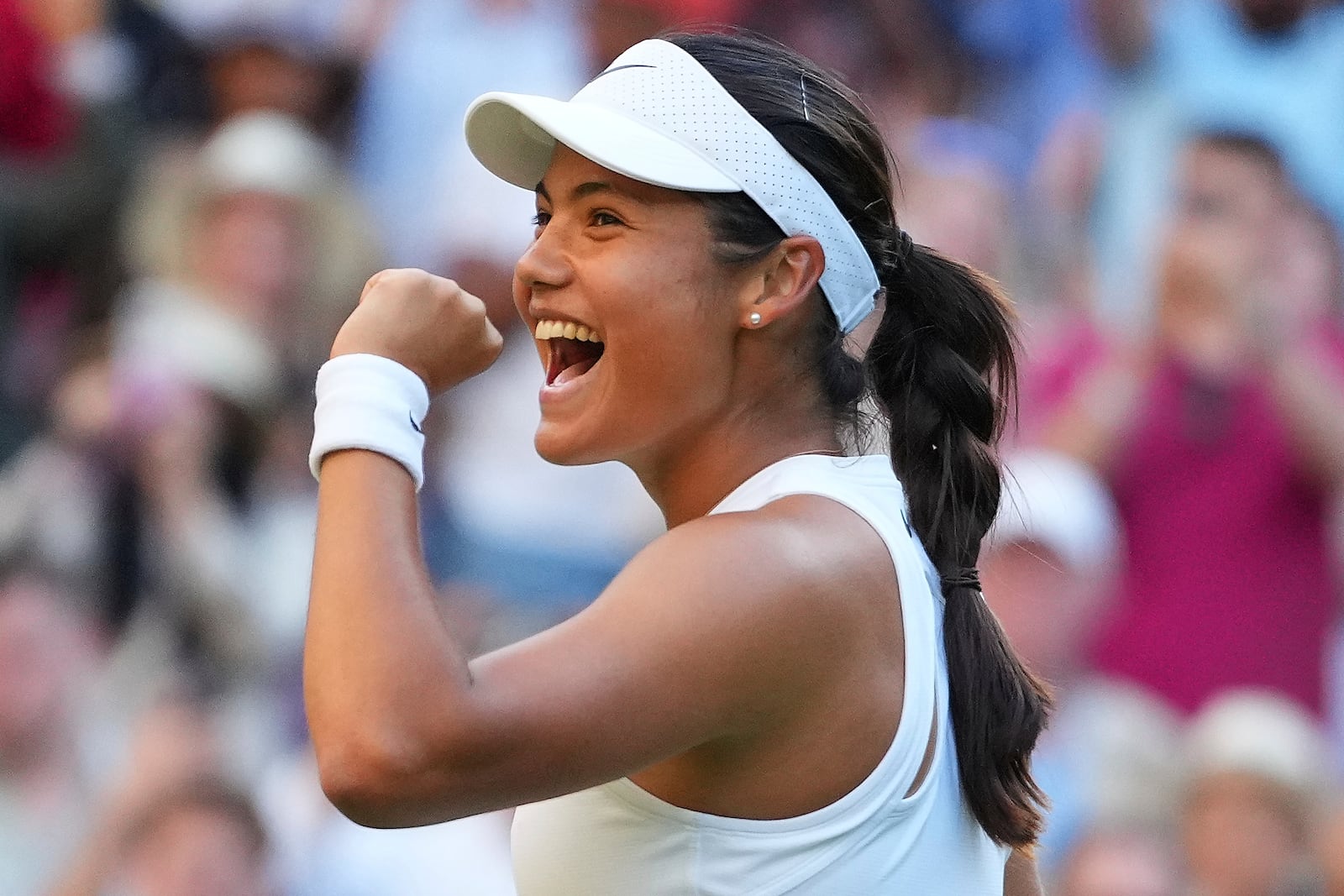 Emma Raducanu of Britain celebrates winning the second round women's singles match against Marketa Vondrousova of the Czech Republic at the Wimbledon Tennis Championships in London, Wednesday, July 2, 2025.(AP Photo/Kirsty Wigglesworth)