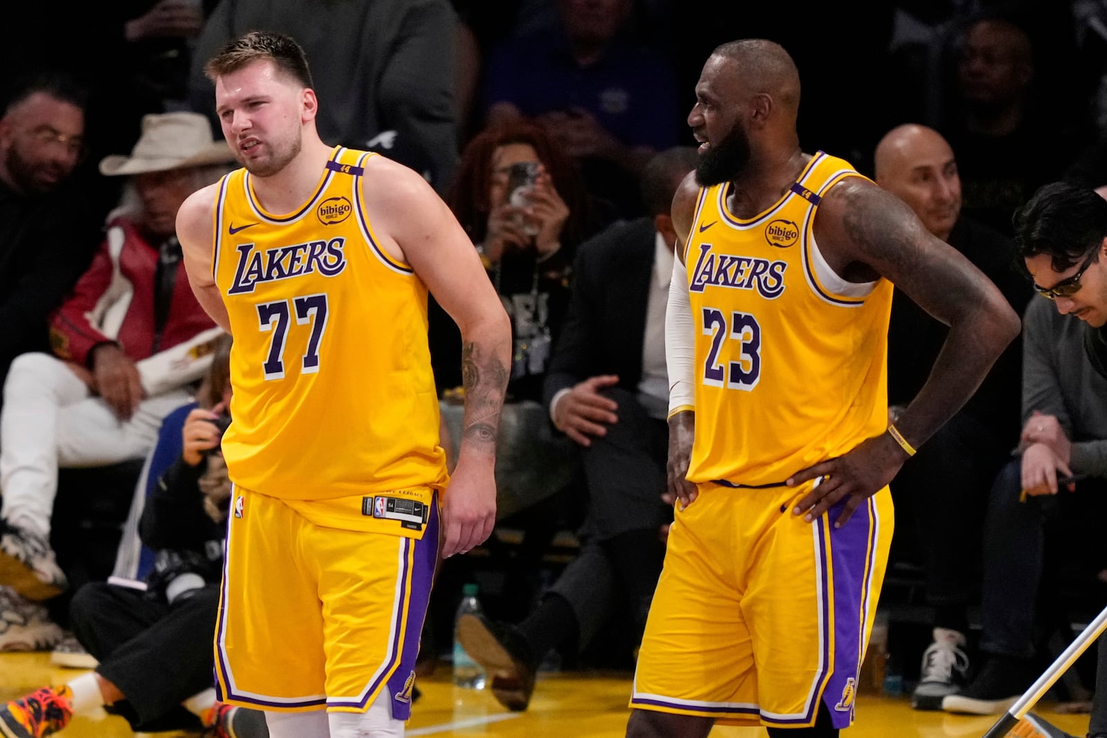 Los Angeles Lakers guard Luka Doncic (77) walks off the court after an injury during the first half in Game 5 of an NBA basketball first-round playoff series against the Minnesota Timberwolves, Wednesday, April 30, 2025, in Los Angeles. (AP Photo/Mark J. Terrill)