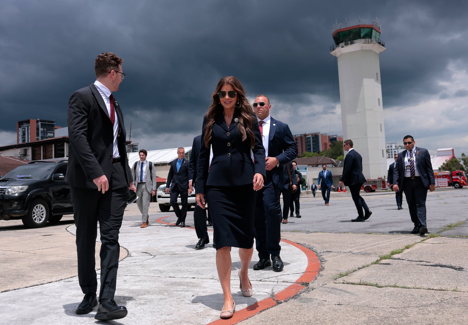 U.S. Homeland Security Secretary Kristi Noem walks to a waiting plane after touring the Department of Homeland Security operations at La Aurora International Airport, in Guatemala City, Thursday, June 26, 2025. (Anna Moneymaker/Pool Photo via AP)
