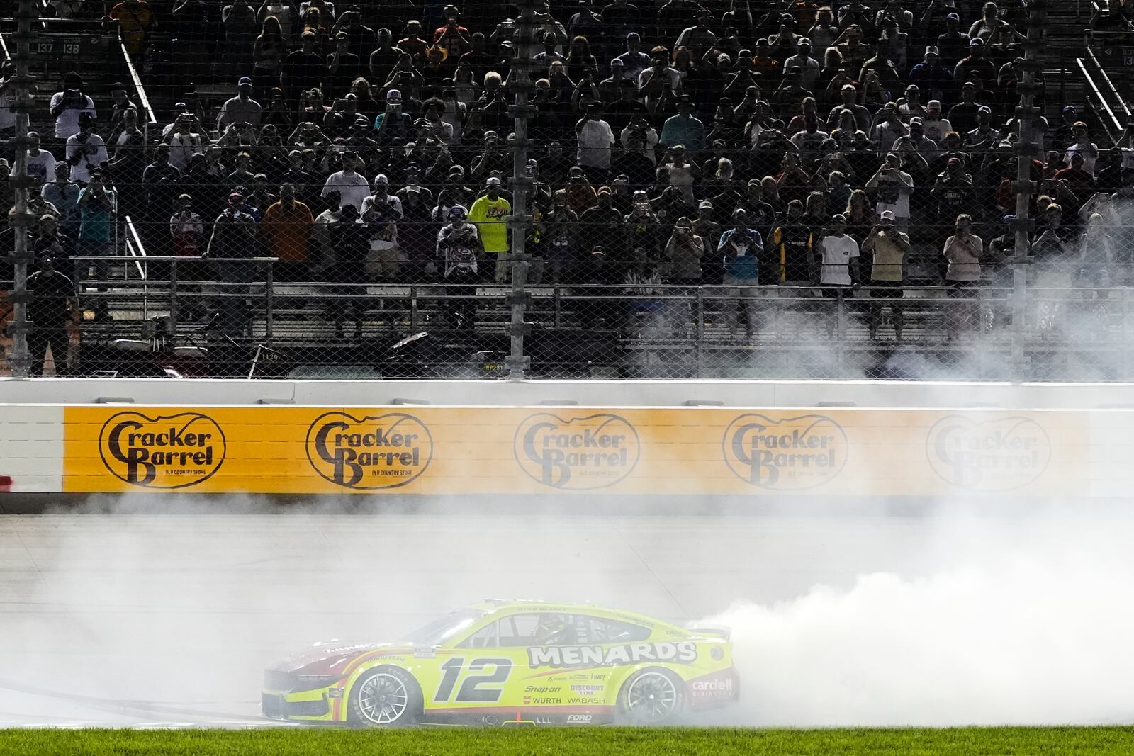 Ryan Blaney does a burnout after winning a NASCAR Cup Series auto race Sunday, June 1, 2025, in Lebanon, Tenn. (AP Photo/George Walker IV)