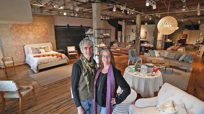 Vicki Rulli and her husband Tom Heaphey, owners of Itinerant Studio have resently opened up part of their old warehouse building on West Jefferson Street for a home decore boutique called Duo Home. BILL LACKEY/STAFF