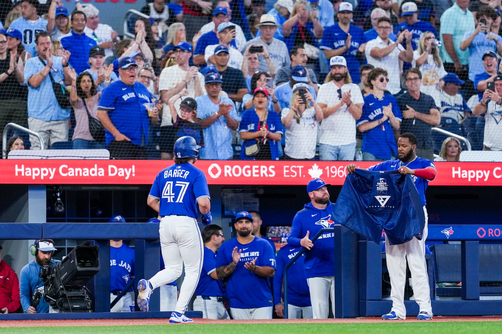 Toronto Blue Jays' Addison Barger (47) celebrates after his solo home run with Vladimir Guerrero Jr., front right, during fifth-inning baseball game action against the New York Yankees in Toronto, Thursday, July 3, 2025. (Thomas Skrlj/The Canadian Press via AP)
