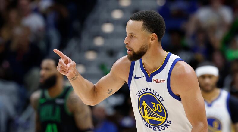 Golden State Warriors guard Stephen Curry reacts to a three-point basket against the New Orleans Pelicans during the third quarter of an NBA basketball game, Sunday, Nov. 16, 2025, in New Orleans. (AP Photo/Butch Dill)