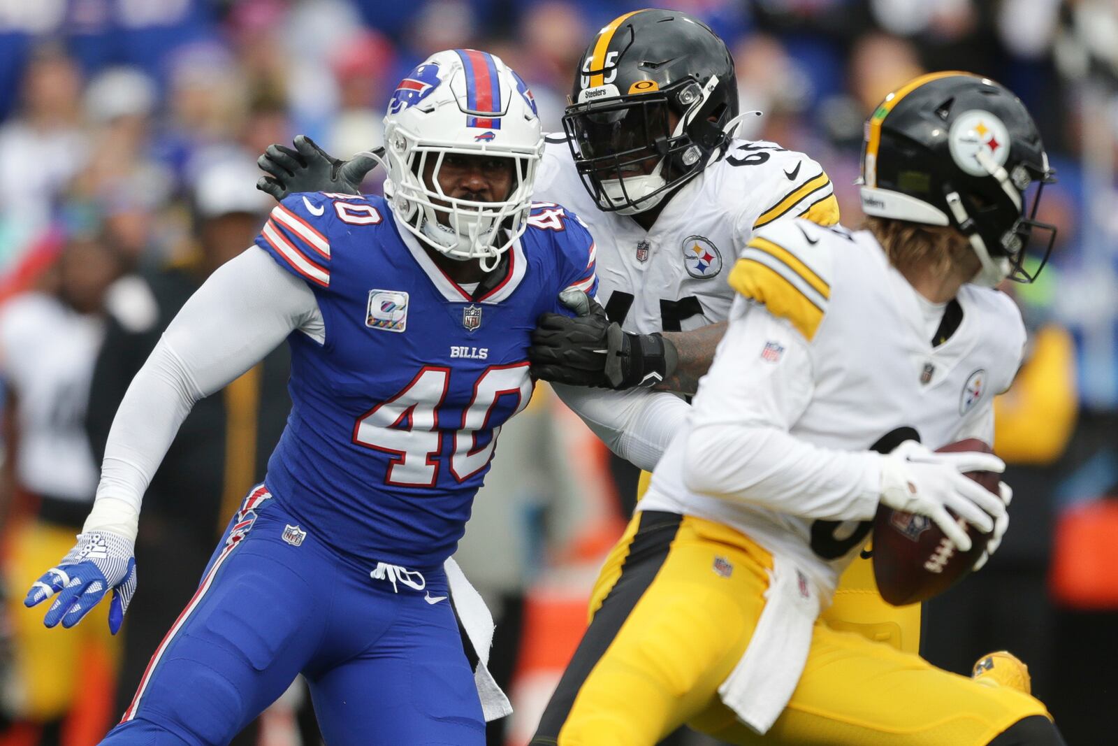 FILE - Buffalo Bills linebacker Von Miller (40) gets around Pittsburgh Steelers offensive tackle Dan Moore Jr. (65) before sacking quarterback Kenny Pickett (8) during the second half of an NFL football game Sunday, Oct. 9, 2022, in Orchard Park, N.Y. (AP Photo/Joshua Bessex, File)