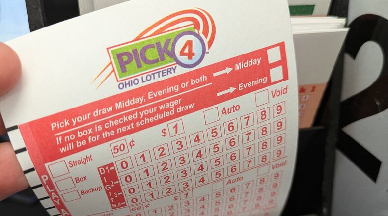 The Ohio Lottery Pick 4 game card in local store in the Dayton area. SAM WILDOW\STAFF