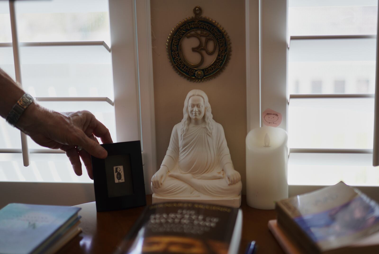 Objects reflecting Philip McLemore's yoga practice sit in his office at his home in Eagle Mountain, Utah, on Thursday, April 24, 2025. (AP Photo/Jessie Wardarski)