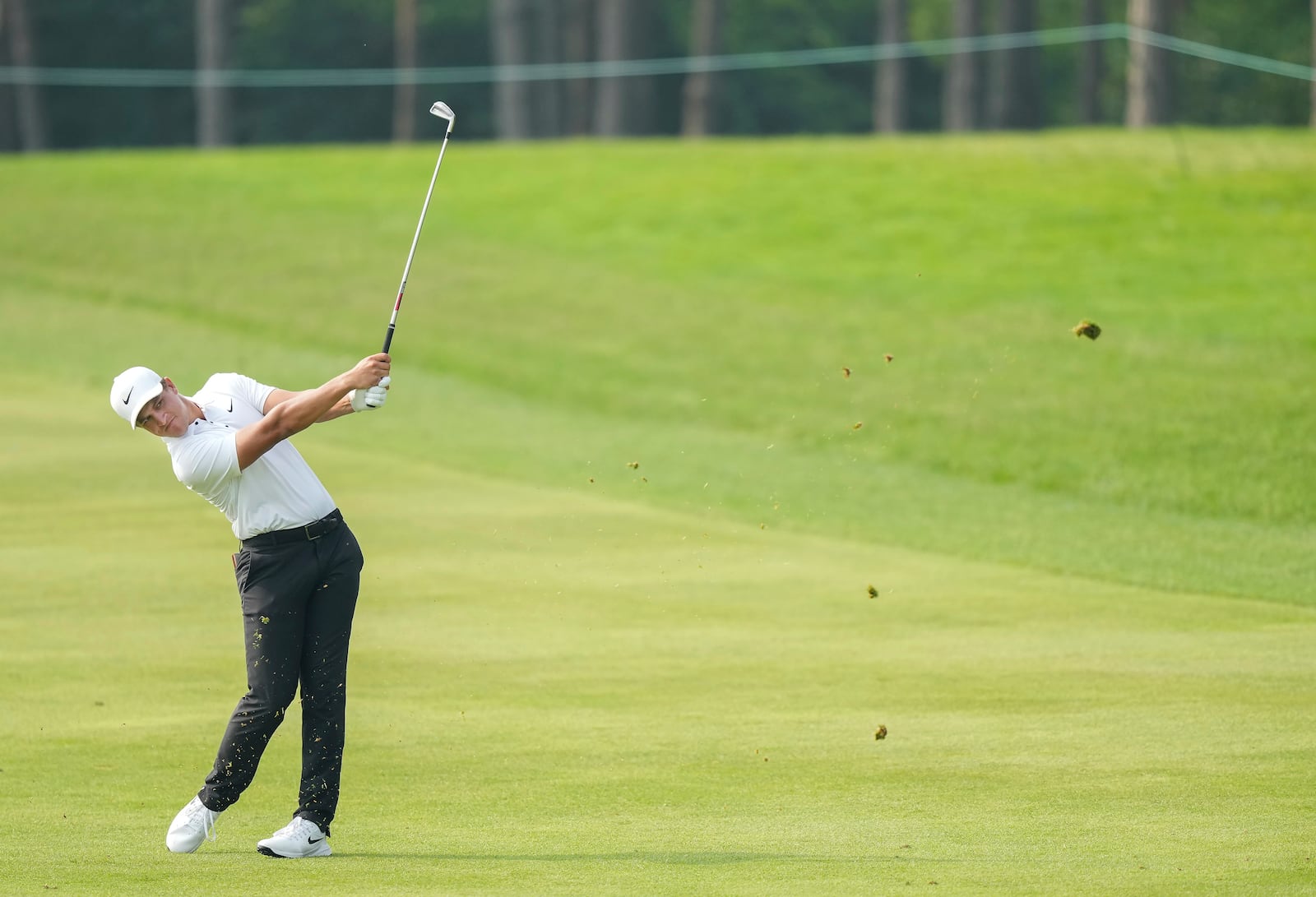 Cameron Champ hits his approach shot from the 18th fairway during the first round of the Canadian Open golf tournament in Caledon, Ontario, Thursday, June 5, 2025. (Nathan Denette/The Canadian Press via AP)
