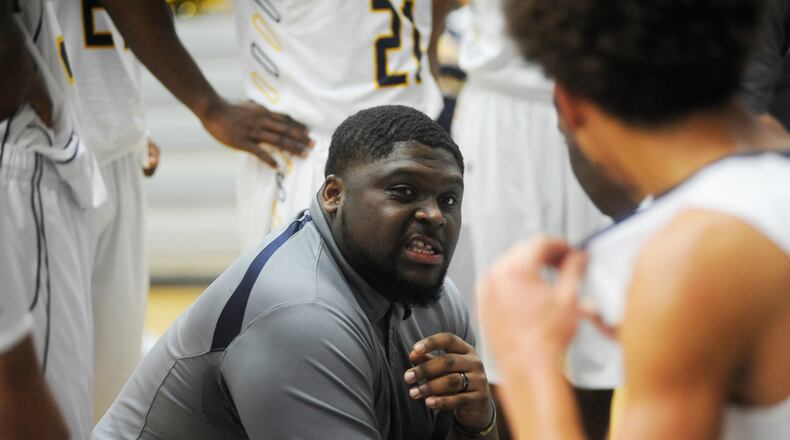 Springfield coach Isaiah Carson addresses the Wildcats. Springfield defeated Oak Hills 71-62 in the boys high school basketball GWOC/GMC Holiday Hoops Challenge at Fairmont's Trent Arena on Saturday, Dec. 27, 2014. MARC PENDLETON / STAFF