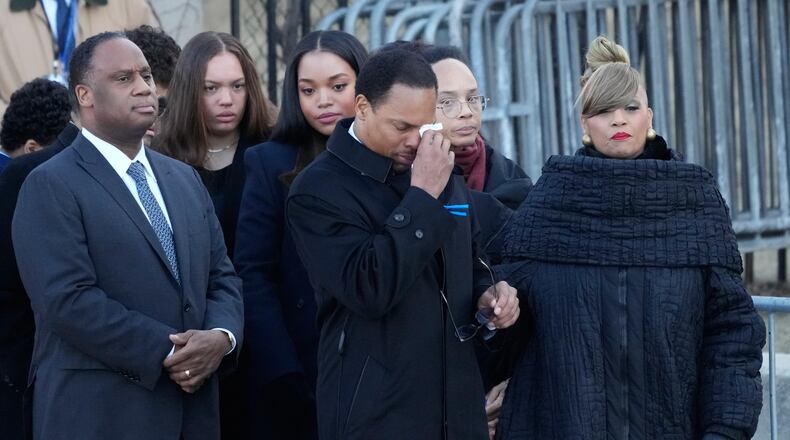 The family of Reverend Jesse Jackson arrives as Yusep Jackson wipes his eyes before public visitation at Rainbow/PUSH Coalition in Chicago, Thursday, Feb. 26, 2026. (AP Photo/Nam Y. Huh)