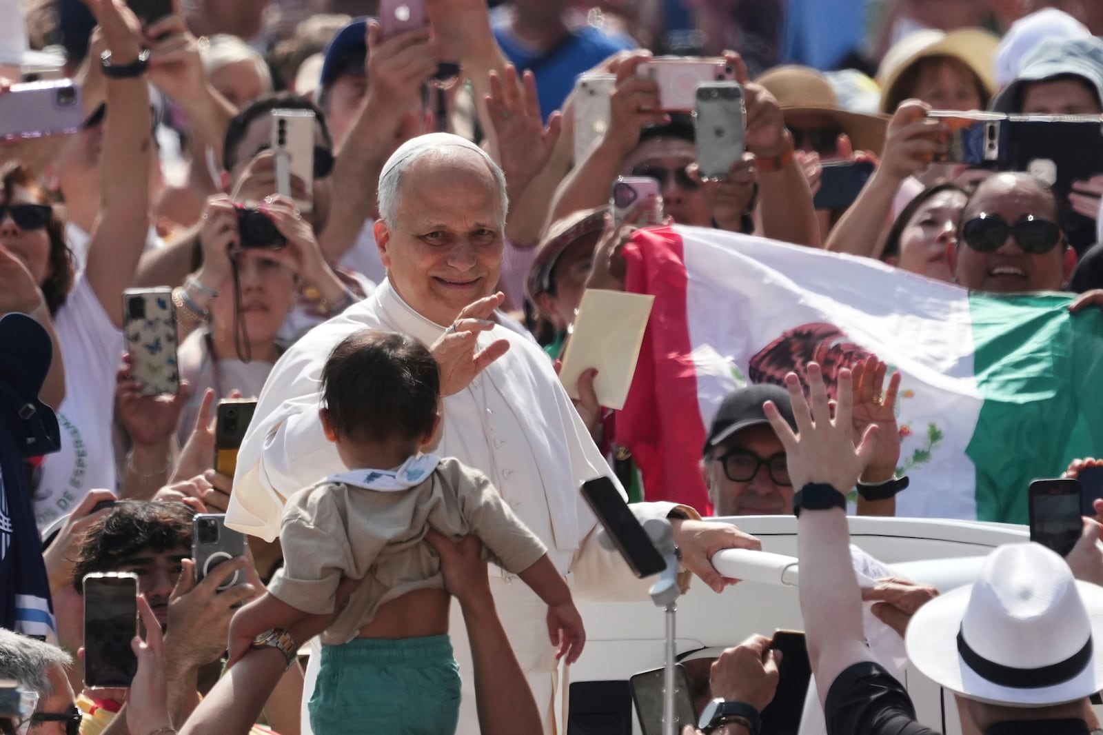 Pope Leo XIV waves as he arrives for his weekly general audience in St. Peter's Square at The Vatican, Wednesday, June 11, 2025. (AP Photo/Andrew Medichini)