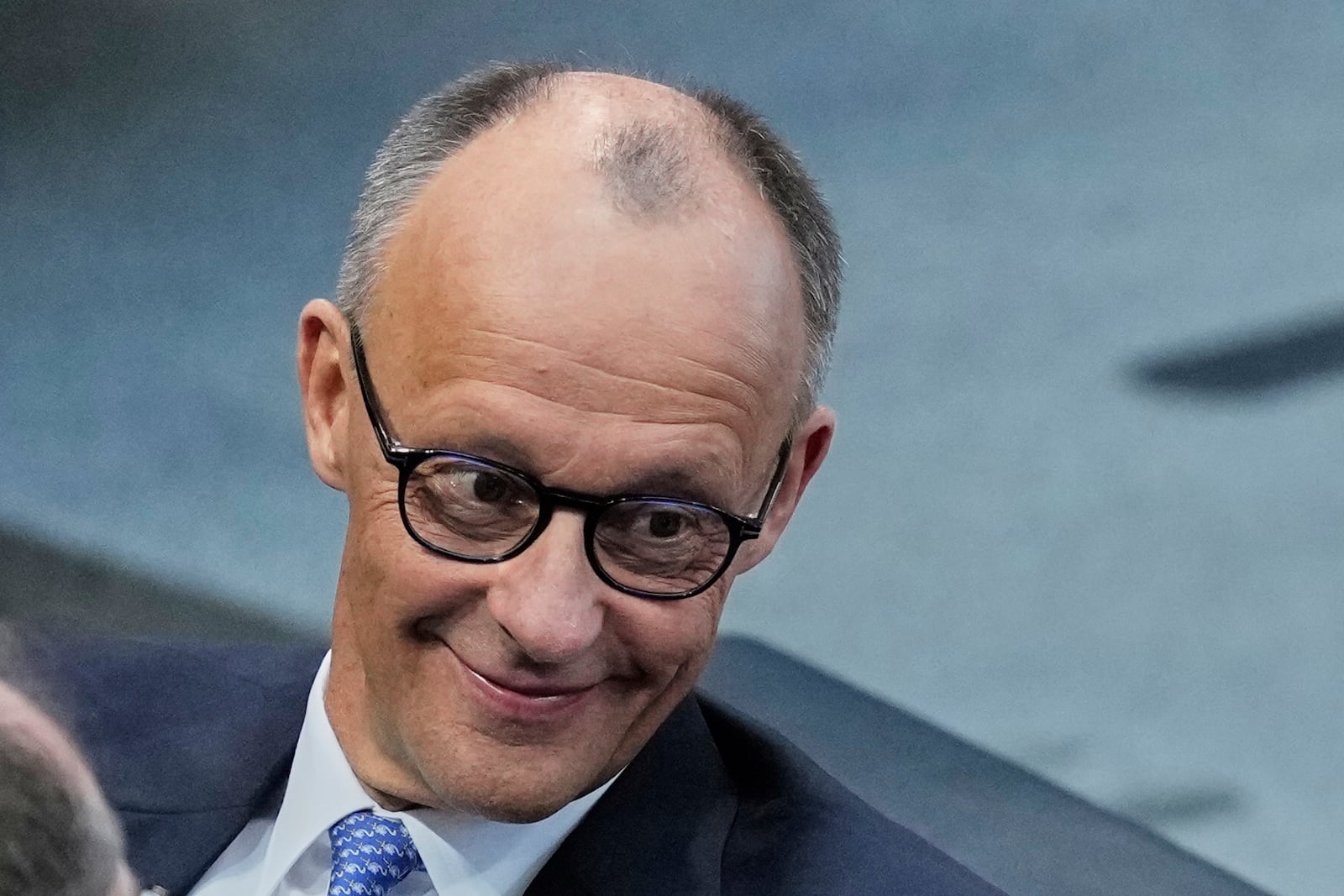 Friedrich Merz waits for the beginning of a session where he is supposed to be elected new Chancellor in the parliament Bundestag in Berlin, Tuesday, May 6, 2025. (AP Photo/Ebrahim Noroozi)