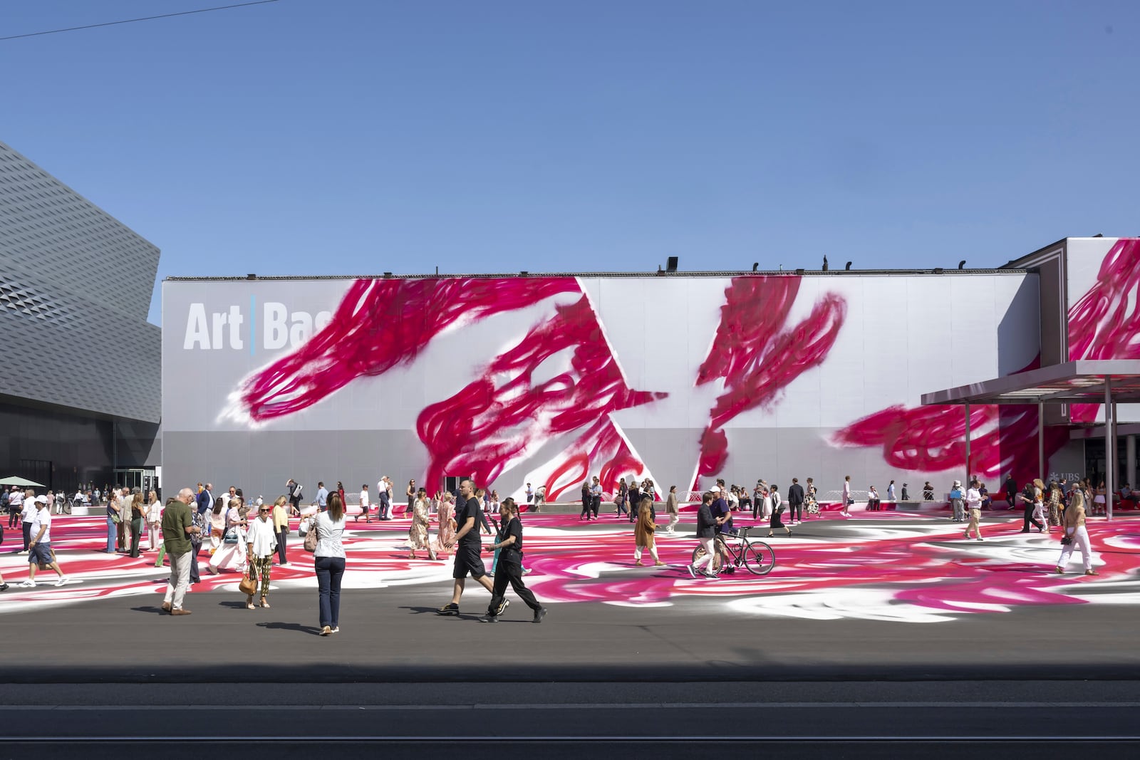 The artwork CHOIR (2025) by German artist Katharina Grosse adorns the Messeplatz at the Art Basel 2025, in Basel, Switzerland, Tuesday, June 17, 2025. (Georgios Kefalas/Keystone via AP)