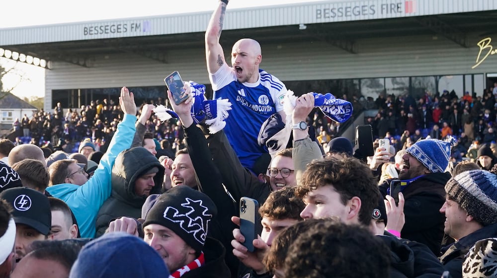 Macclesfield Town's Josh Kay celebrates with fans following the FA Cup third round soccer match between Macclesfield Town and Crystal Palace, at the Leasing.com Stadium, Macclesfield, England, Saturday, Jan. 10, 2026. (Martin Rickett/PA via AP)