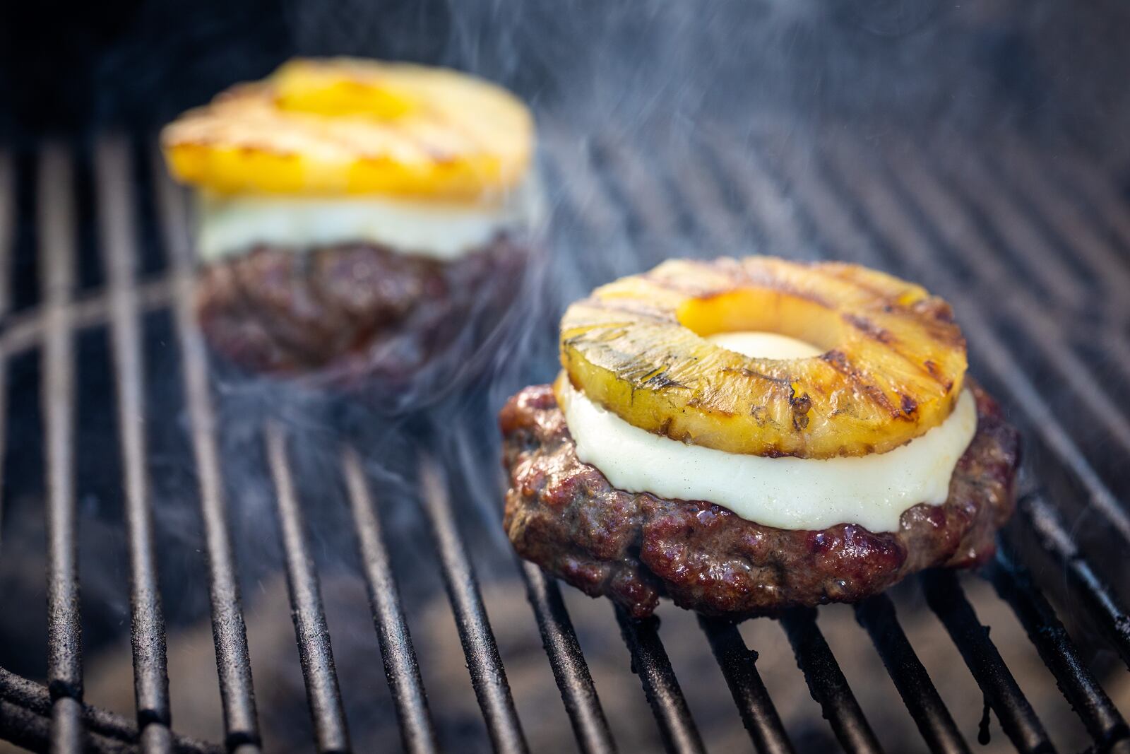 In Englewood police sergeant Mike Lang's first cookbook, "One-Beer Grilling," he cooks up grilled culinary treats like this Hawaiian Burger.