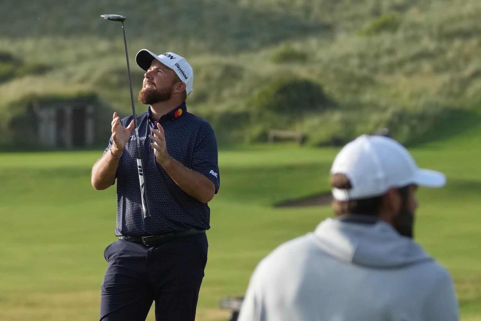 Shane Lowry of Ireland, shows is club up as he reacts after putting on the 16th green during the second round of the British Open golf championship at the Royal Portrush Golf Club, Northern Ireland, Friday, July 18, 2025. (AP Photo/Jon Super)