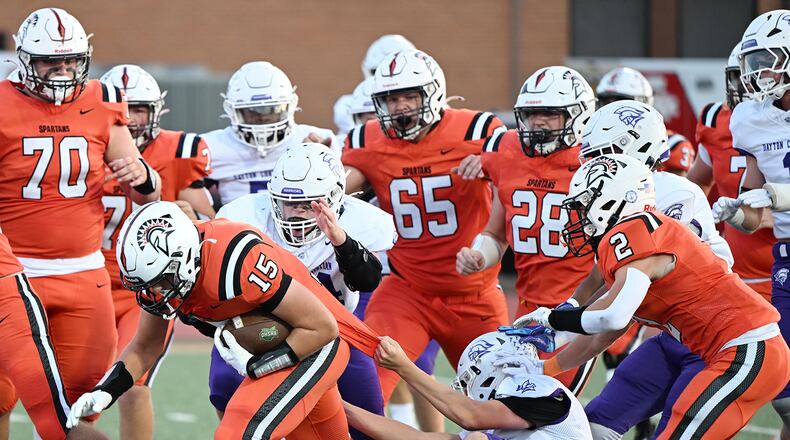 Waynesville High School Mac Sullivan runs the ball through the Dayton Christian defense during their game on Friday, Sept. 26 at Spartan Stadium. The Spartans won 52-35. NICK FALZERANO / CONTRIBUTED PHOTO