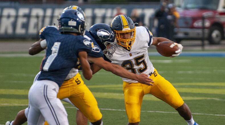 Springfield’s Jeff Tolliver runs into the Fairmont defense during the first half Friday night. Tolliver scored on a 46-yard run in the first half. The Wildcats won 34-7. Jeff Gilbert/CONTRIBUTED