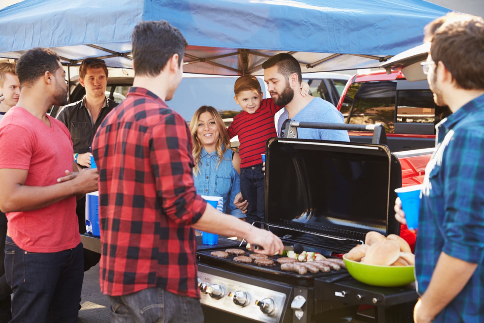 A portable grill, utensils, tin foil and other items are essential for comfortable sports tailgating events. ISTOCK PHOTO