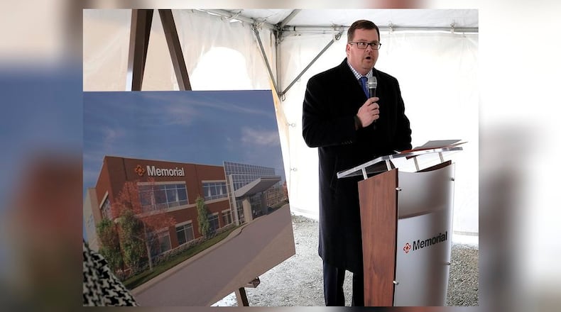 Chip Hubbs, president and CEO of Memorial Health, speaks during a ground breaking ceremony for a new Memorial Health outpatient medical center in Urbana Friday. Bill Lackey/Staff