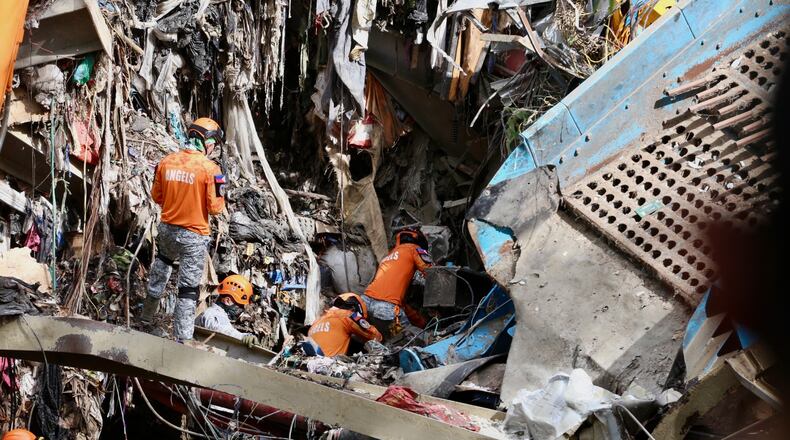 Rescuers continue operations on a collapsed waste segregation facility in Binaliw, Cebu city, central Philippines on Saturday, Jan. 10, 2026. (AP Photo/Jacqueline Hernandez)