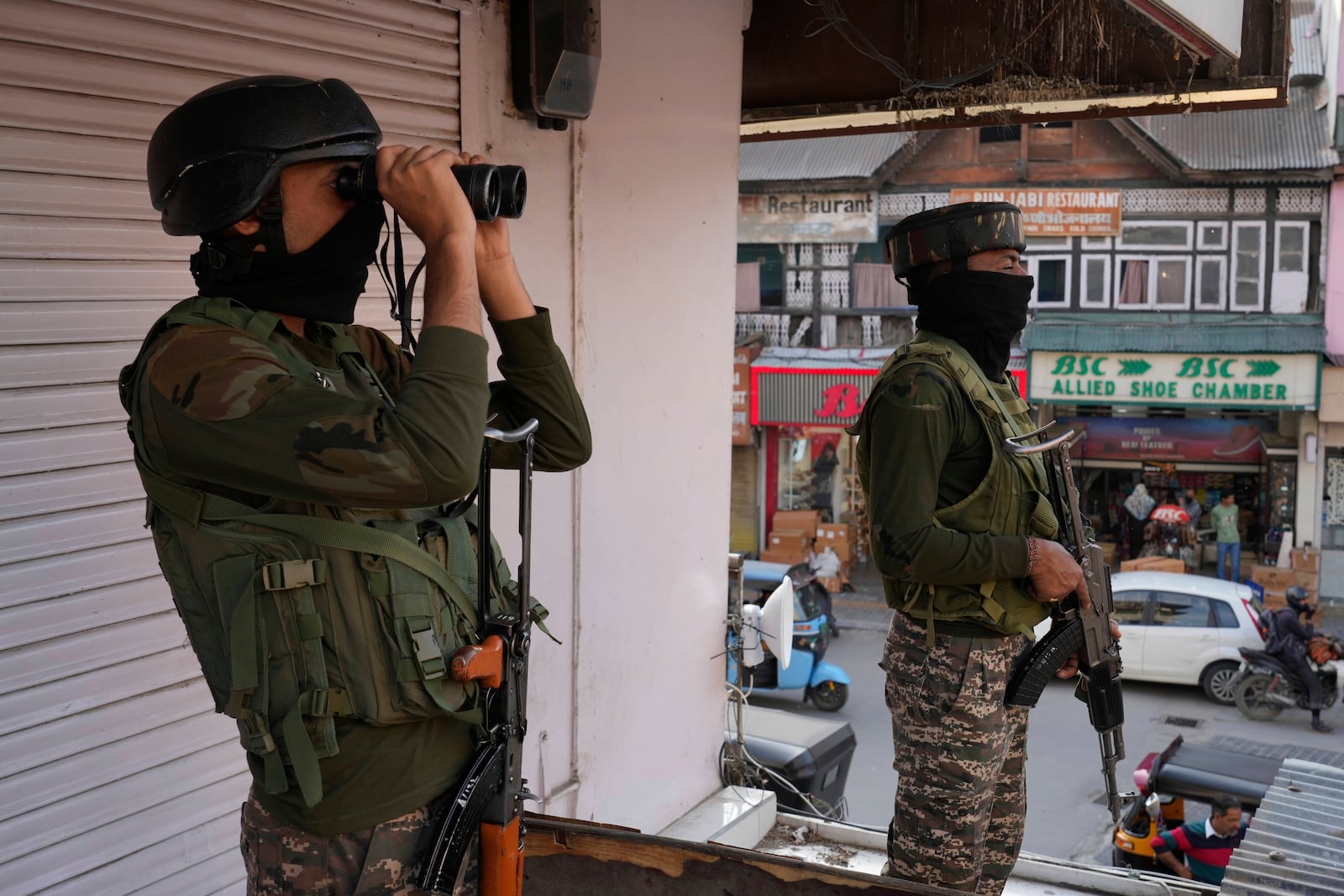 Indian soldiers guard at a market in Srinagar, Indian controlled Kashmir, Tuesday, May 6, 2025. (AP Photo/Mukhtar Khan)