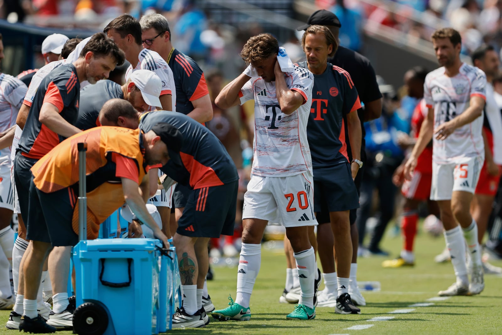 Bayern players take a cooling break during the Club World Cup Group C soccer match between Benfica and Bayern Munich in Charlotte, N.C., Tuesday, June 24, 2025. (AP Photo/Nell Redmond)