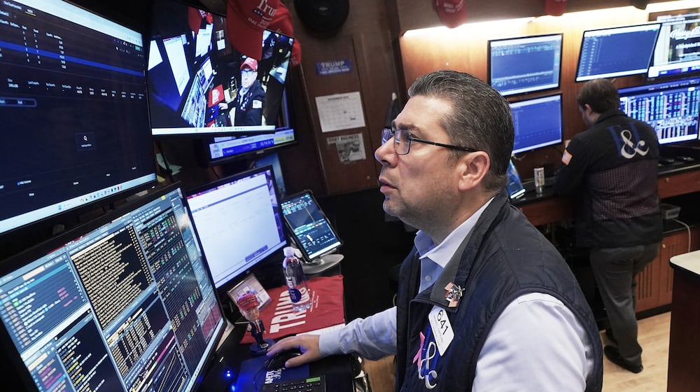 Trader Michael Capolino works on the floor of the New York Stock Exchange, Monday, Nov. 24, 2025. (AP Photo/Richard Drew)