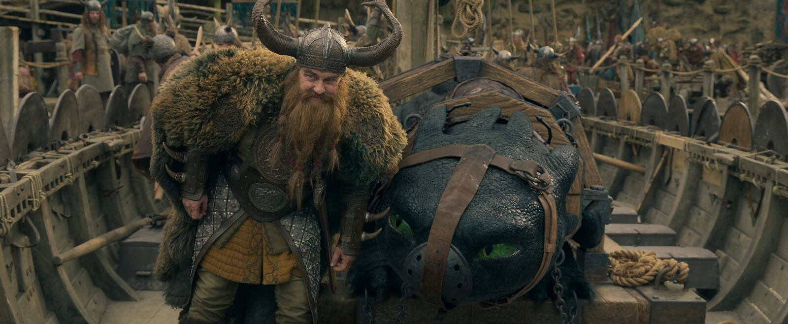 This image released by Universal Pictures shows Gerard Butler, left, and Night Fury dragon, Toothless in a scene from "How to Train Your Dragon.", (Universal Pictures via AP)