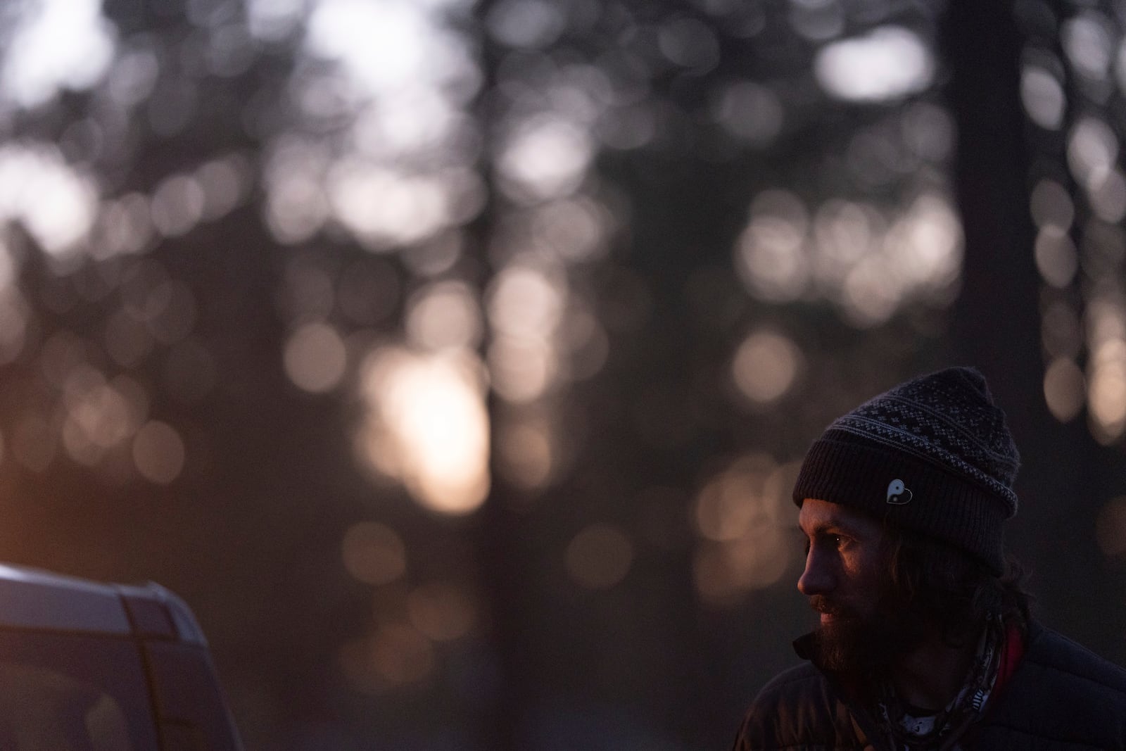 Nick Campbell looks up while talking to a volunteer at a homeless encampment in Deschutes National Forest Wednesday, April 30, 2025 near Bend, Ore. (AP Photo/Jenny Kane)