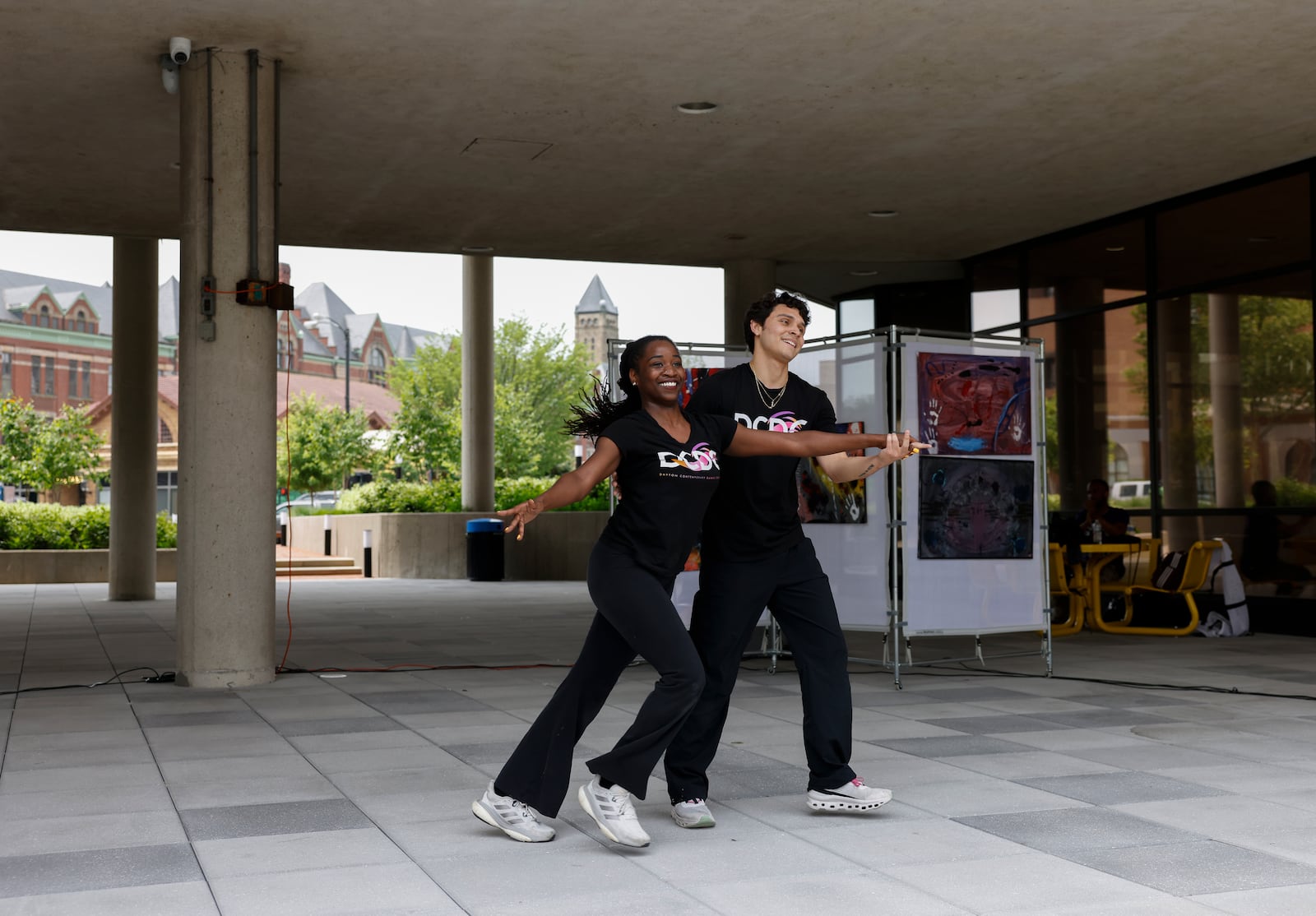 Nicolay Dorsett, left, and Fabio Tello Munoz with Dayton Contemporary Dance Company, perform during Project Jericho Summer Arts Camp on Friday, June 13, 2025, at City Hall Plaza. JOSEPH COOKE/STAFF