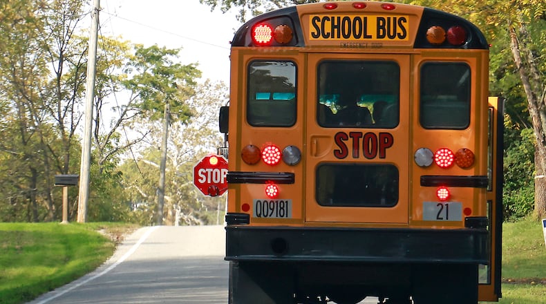 Shawnee school buses are now equiped with new cameras to catch drivers going around the bus when it's letting children on and off. BILL LACKEY/STAFF