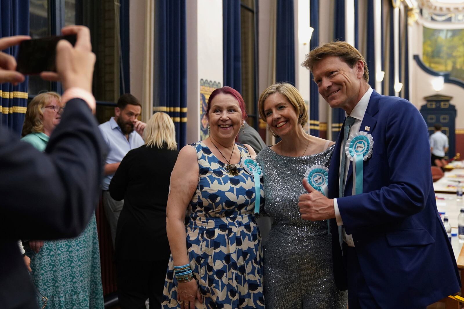 Reform UK's Greater Lincolnshire mayoral candidate Dame Andrea Jenkyns, centre, with Reform U.K. deputy leader Richard Tice, right, during the count at Grimsby Town Hall, in Lincolnshire, England, for the Greater Lincolnshire Mayor election, Friday, May 2, 2025. (Joe Giddens/PA via AP)