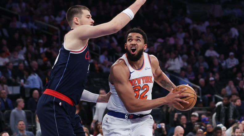 New York Knicks center Karl-Anthony Towns (32) drives to the basket while LA Clippers center Ivica Zubac defends during the second half of an NBA basketball game, Wednesday, Jan. 7, 2026, in New York. (AP Photo/Heather Khalifa)