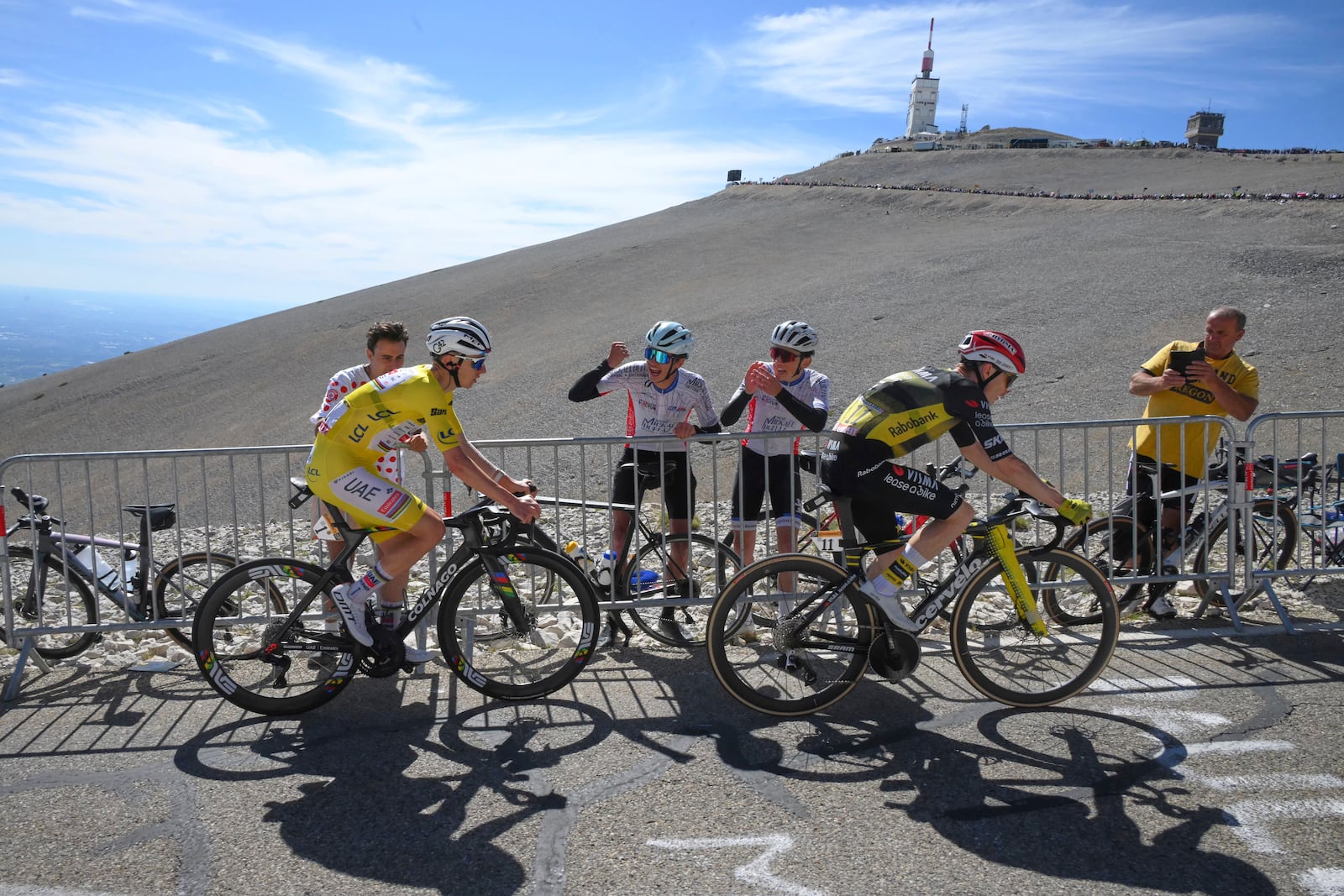 Slovenia's Tadej Pogacar, wearing the overall leader's yellow jersey, follows Denmark's Jonas Vingegaard during the last kilometers of the sixteenth stage of the Tour de France cycling race over 171.5 kilometers (106.6 miles) with start in Montpellier and finish on the Mont Ventoux, France, Tuesday, July 22, 2025. (Bernard Papon/Pool Photo via AP)