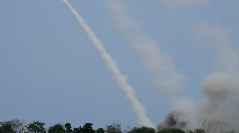 FILE -A U.S. M142 High Mobility Artillery Rocket System (HIMARS) fires a missile during a Combined Joint Littoral Live Fire Exercise at the joint military exercise called "Balikatan", Tagalog for shoulder-to-shoulder in a Naval station in Zambales province, northern Philippines on Wednesday, April 26, 2023. (AP Photo/Aaron Favila, File)