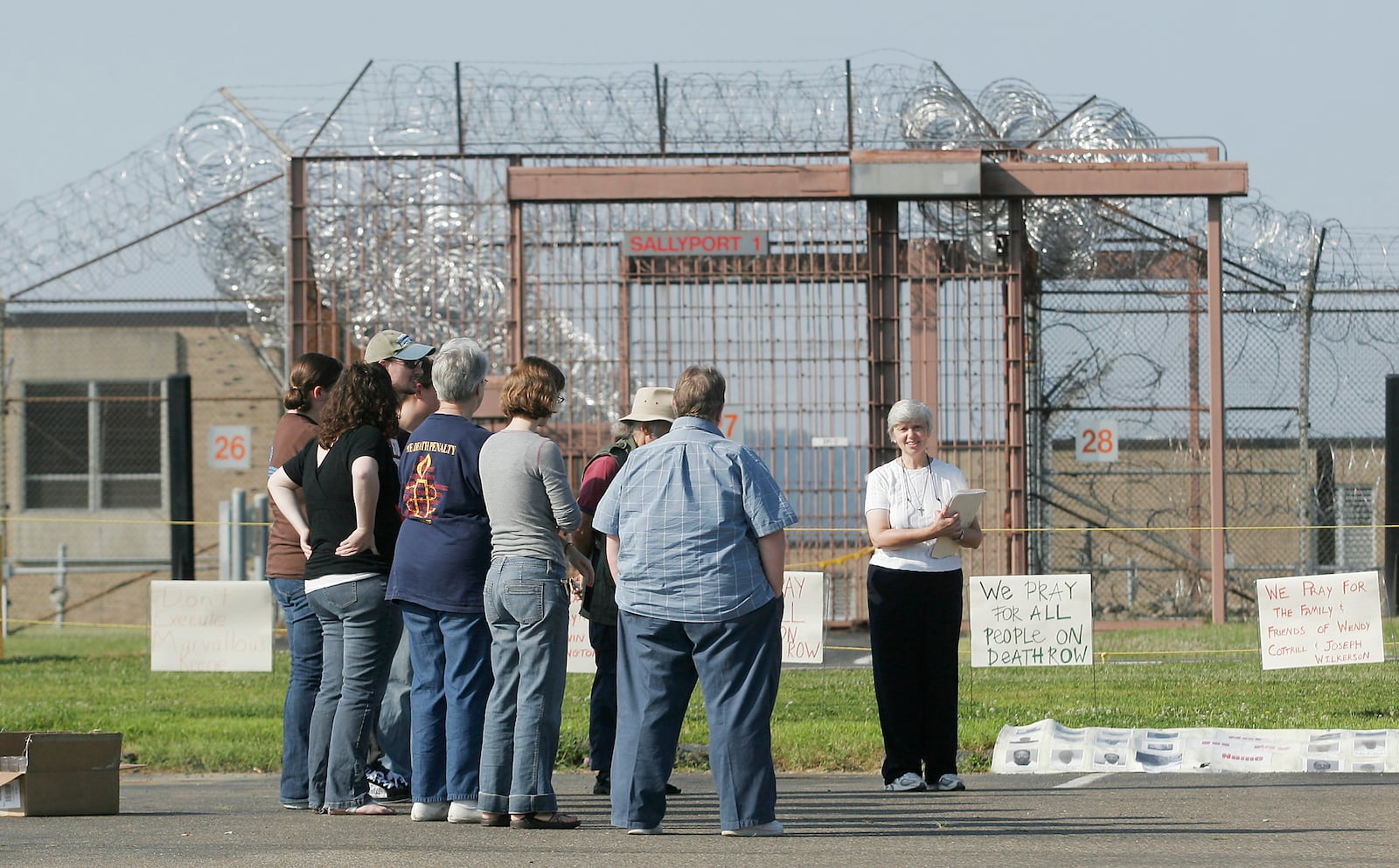 Death penalty opponents hold a vigil outside the Southern Ohio Correctional Facility at Lucasville early Tuesday, July 21, 2009, where Marvallous Keene was executed for his role in the 1992 Dayton Christmas killings. DAYTON DAILY NEWS ARCHIVE