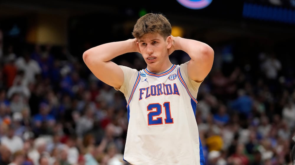 Florida forward Alex Condon (21) reacts after the team lost to Iowa during the second round of the NCAA college basketball tournament Sunday, March 22, 2026, in Tampa, Fla. (AP Photo/Chris O'Meara)